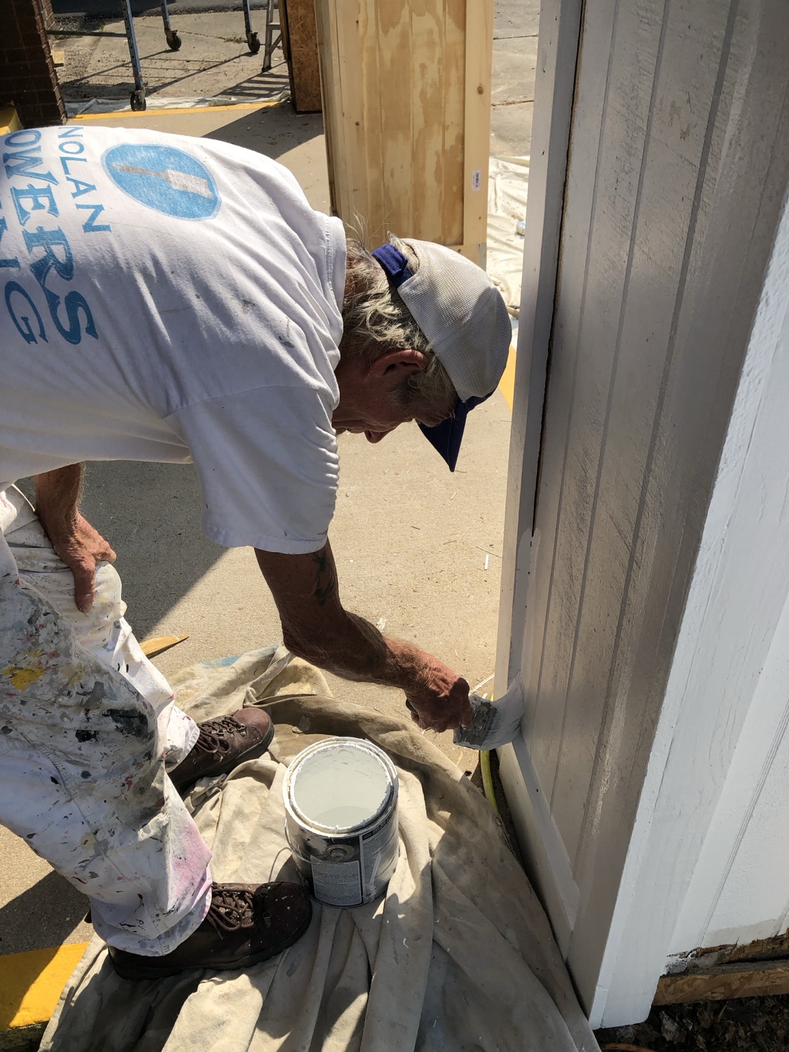Nolan Flowers Sr. painting on a job site