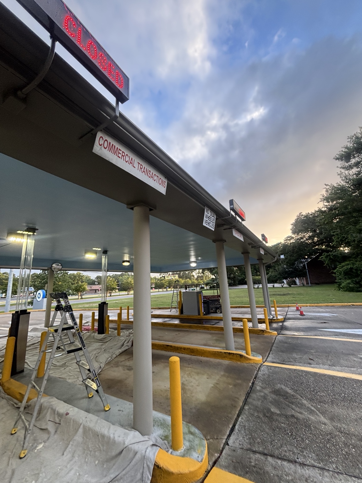 Protected work area during drive-through canopy painting