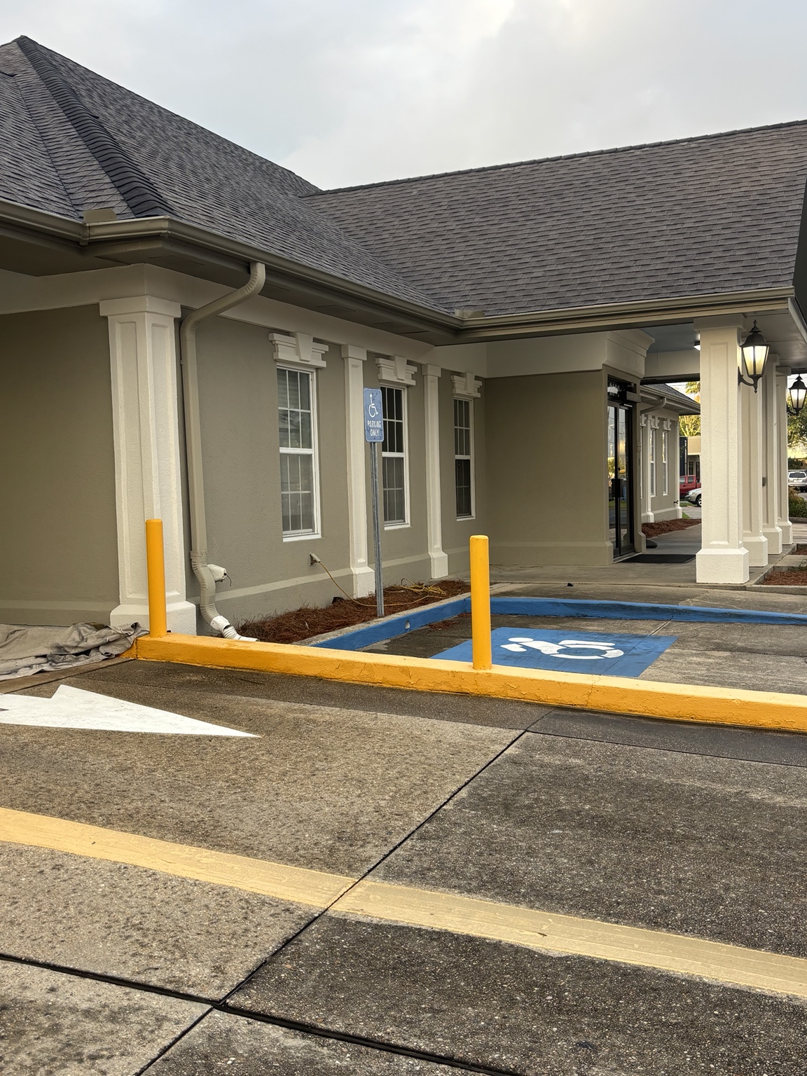 Completed commercial exterior coating work around the bank entrance