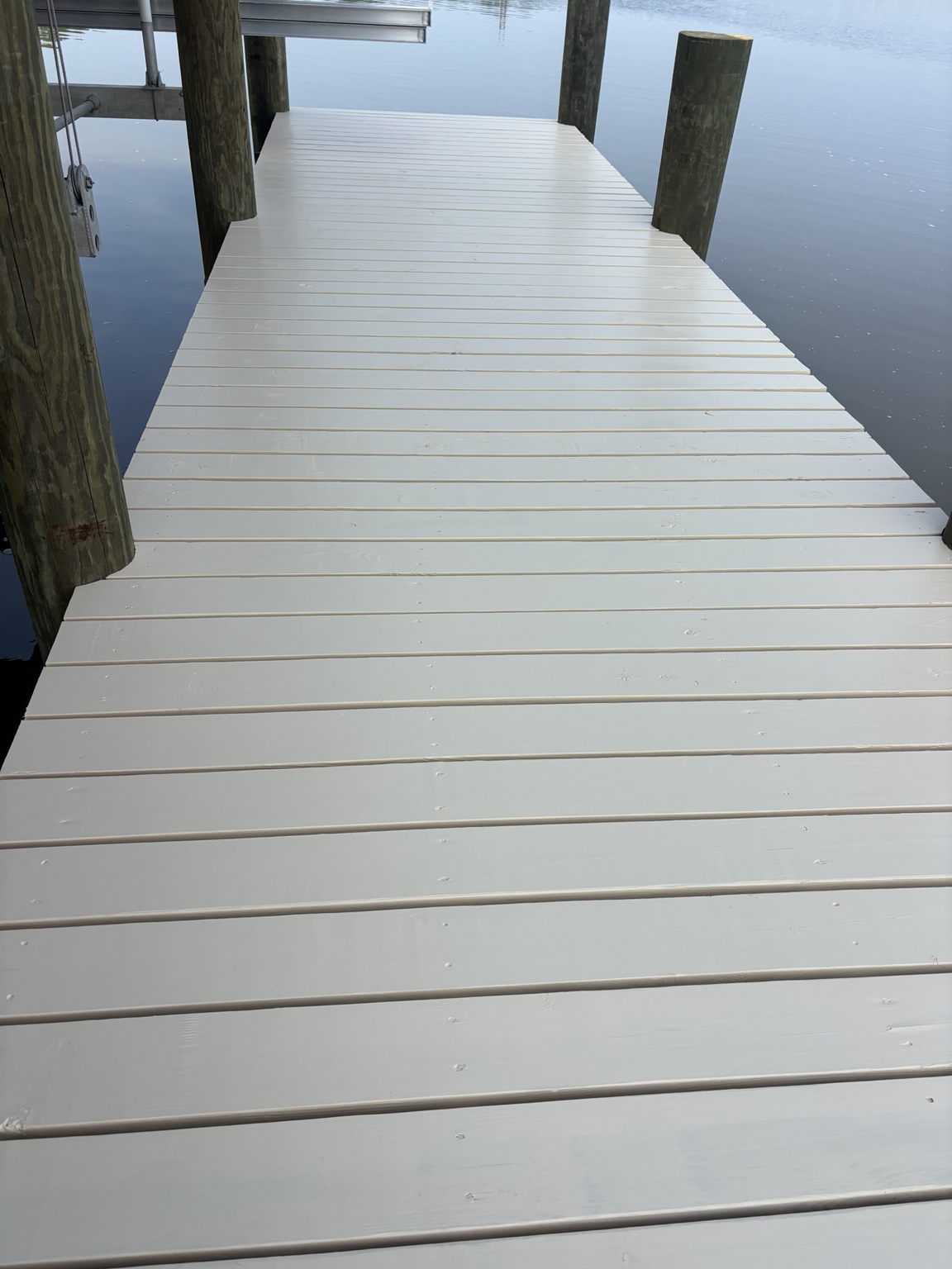 Pier decking finished with solid-color stain